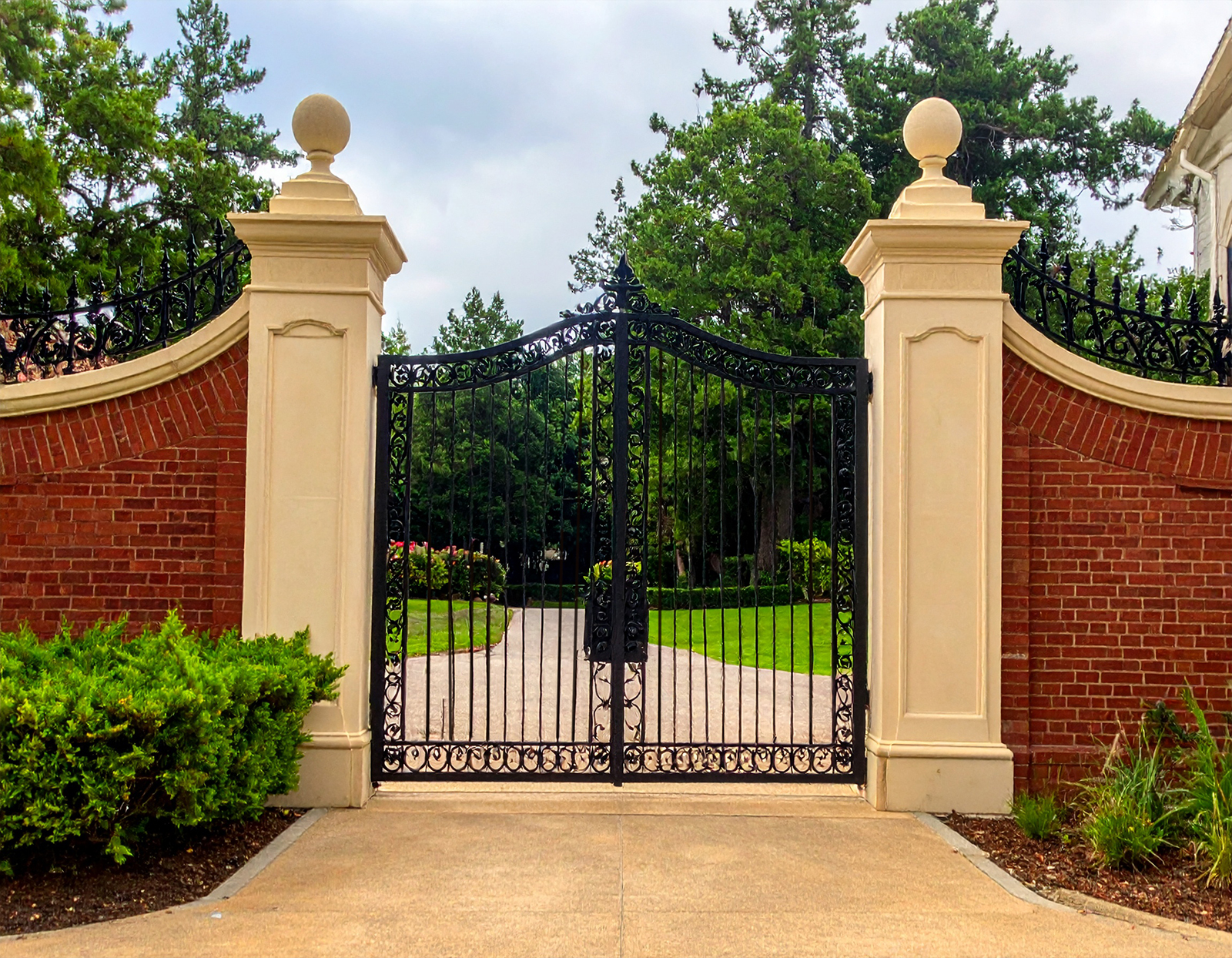 Black wrought iron gate, brick pillars.-deck builder-San Antonio, Texas