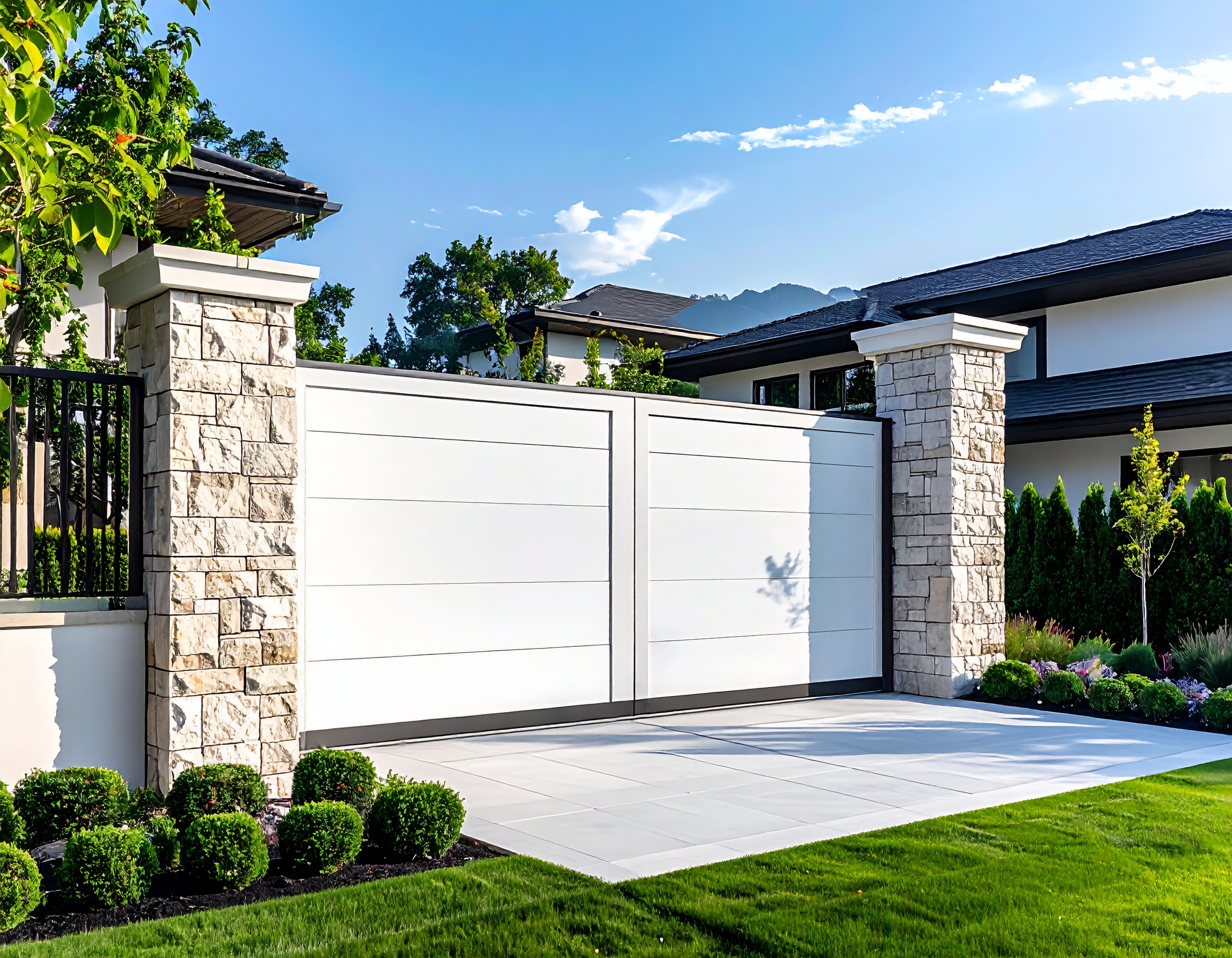 White vinyl gate with stone pillars-deck builder-San Antonio, Texas