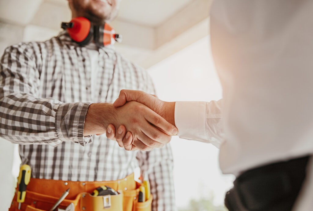 Contractor and builder shaking hands - San Antonio Deck and Fence Works Friendly handshake between homeowner and contractor - San Antonio deck builder and fence installer