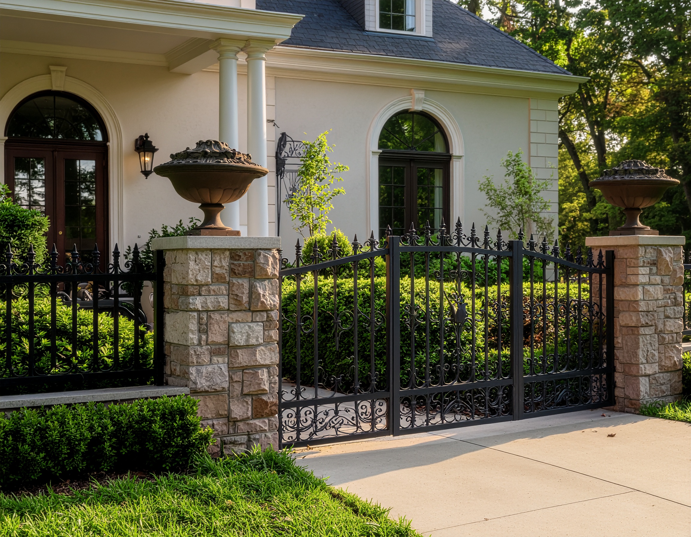 wrought iron fence on mansion 823410 - San Antonio Deck and Fence Works Black wrought iron gate with stone pillars.-deck builder-San Antonio, Texas